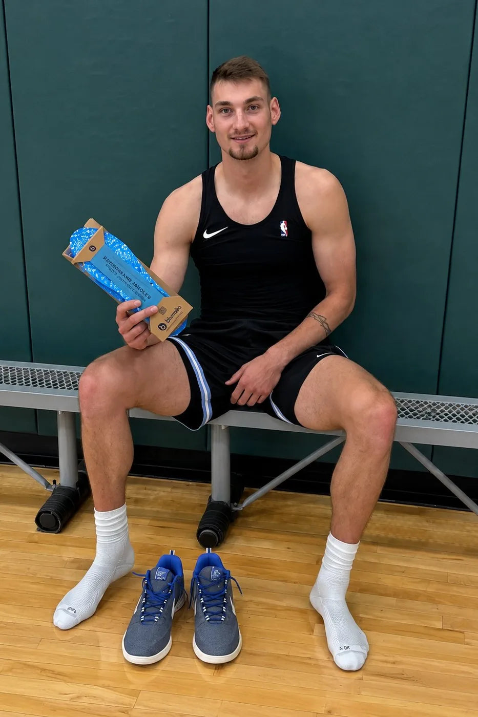 Carson Cooper holding a box of Blumaka NonSlip insoles