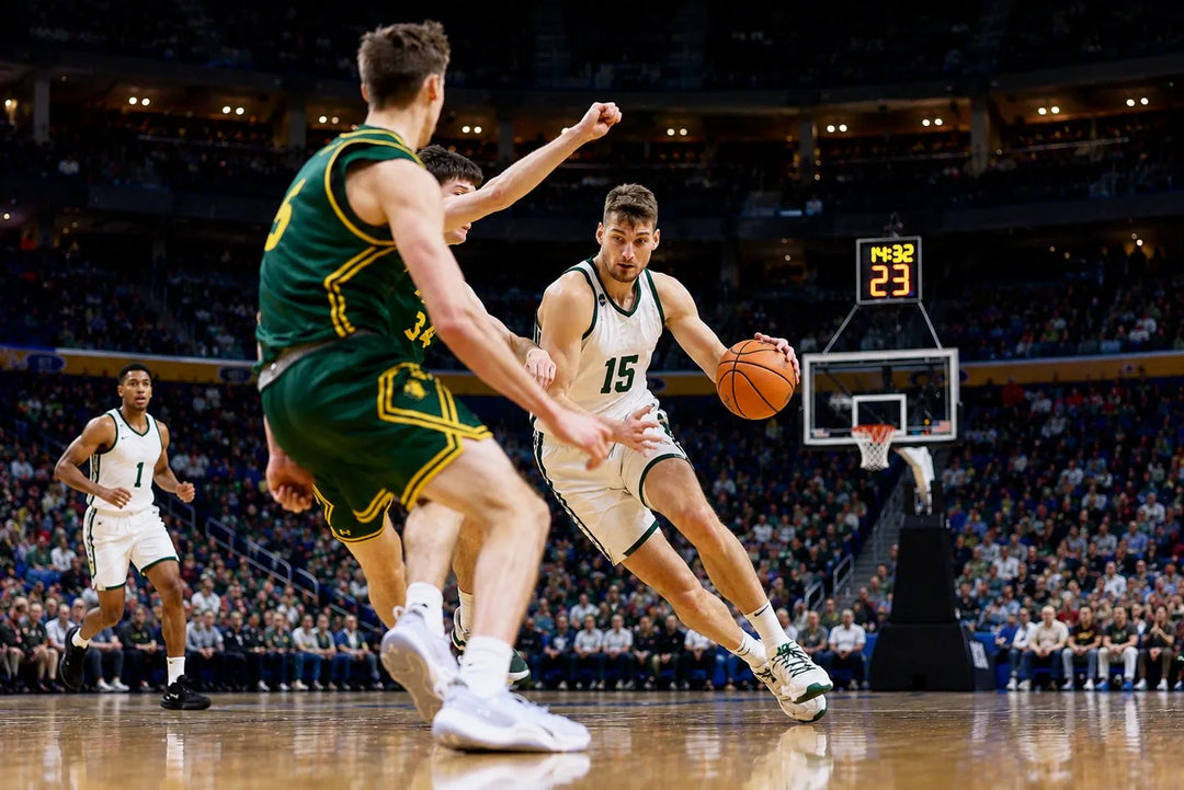 Carson Cooper driving to the basket for Michigan State