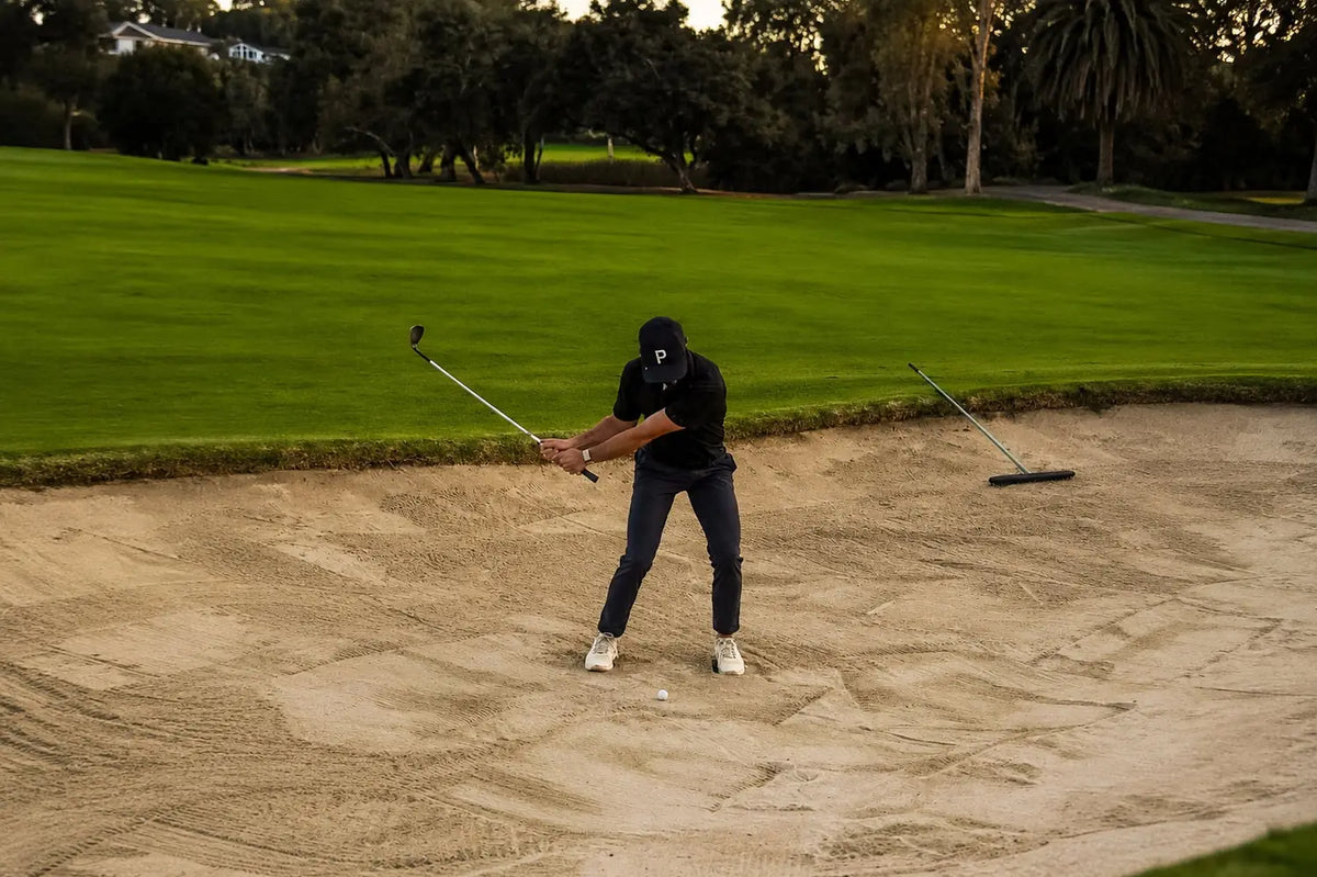 Connor Moore hitting a bunker shot