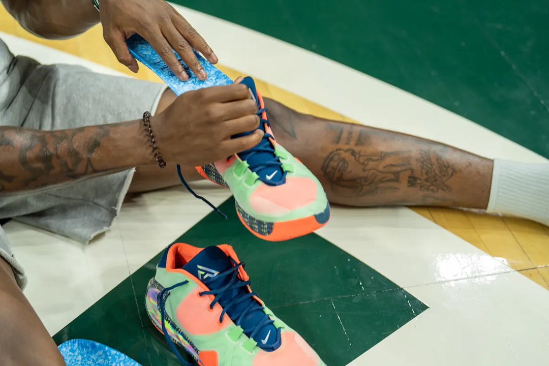 Sliding a Blumaka NonSlip insole into a basketball shoe