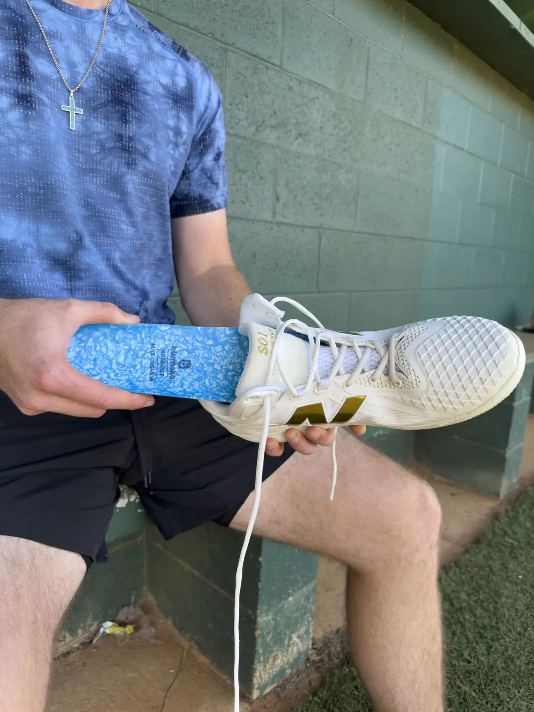 Sliding a Blumaka NonSlip insole into a cleat