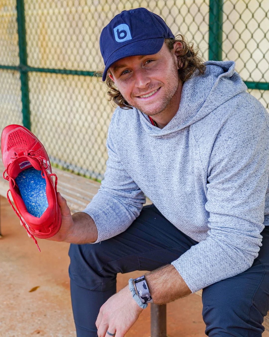 Brendan Donovan holding a cleat fitted with a Blumaka insole