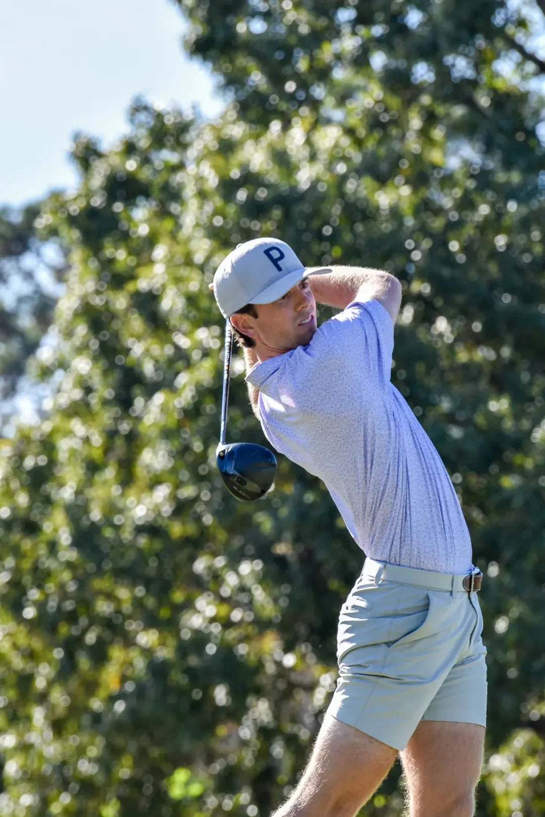 Connor Moore driving through a swing