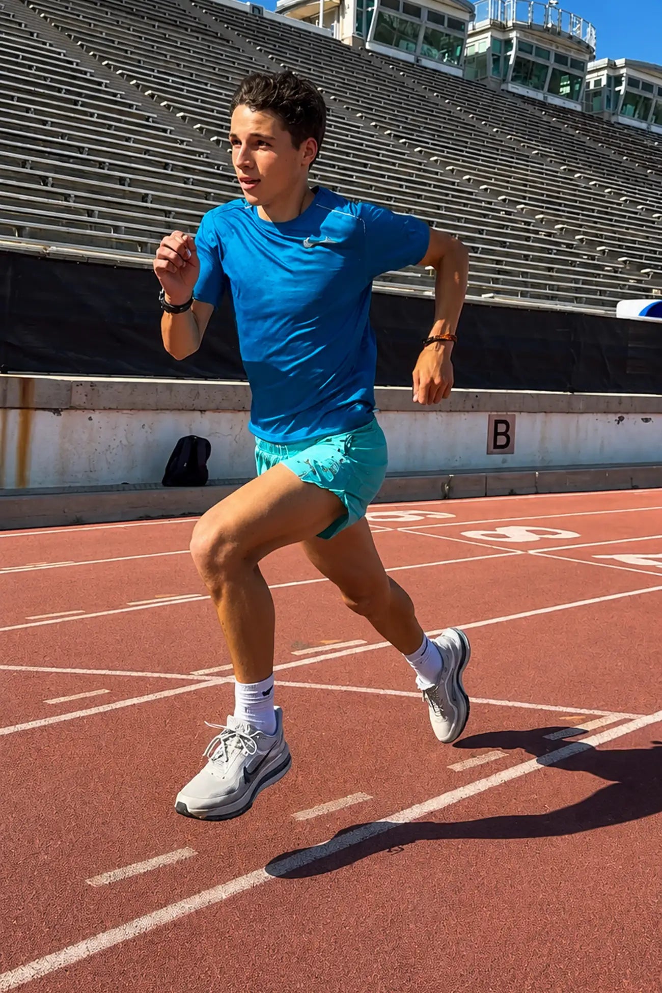 Runner sprinting on a stadium track