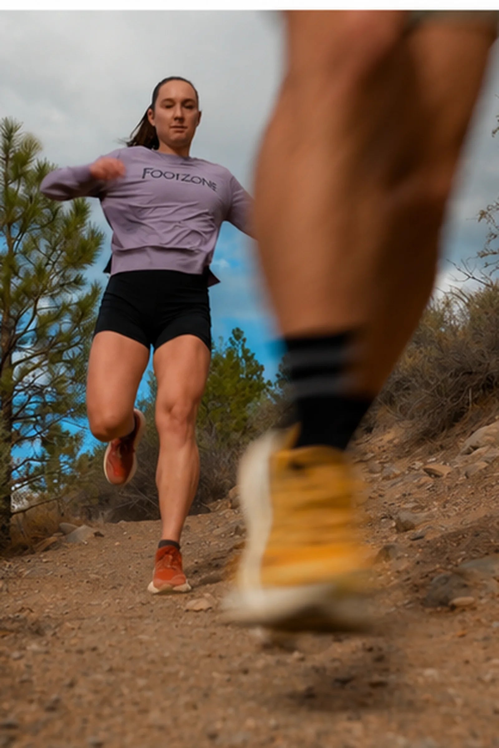 Trail runner climbing a trail