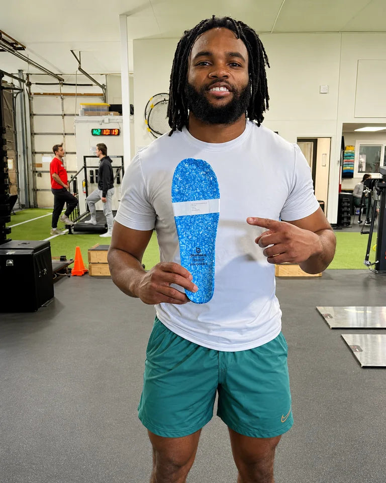 Jaleel McLaughlin holding a Blumaka NonSlip insole